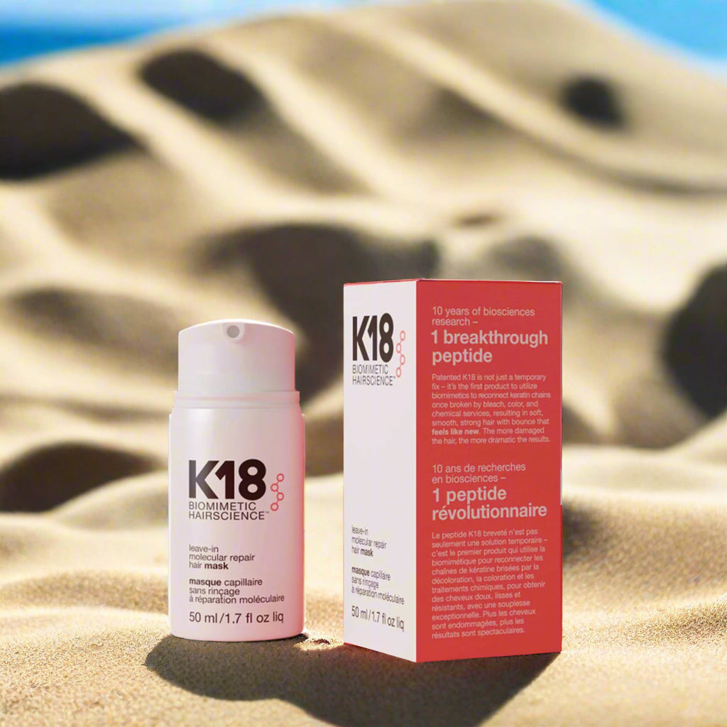 K18 leave-in hair mask from EA SHOPPE in a convenient 50ml container on a sandy background